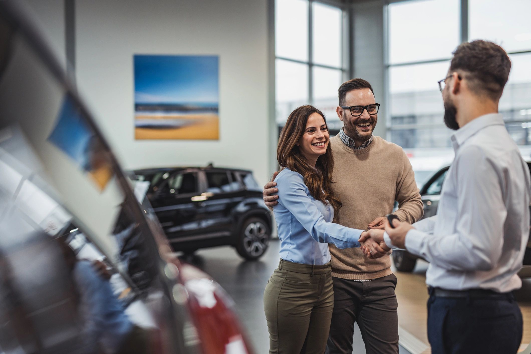 car sales team handshake