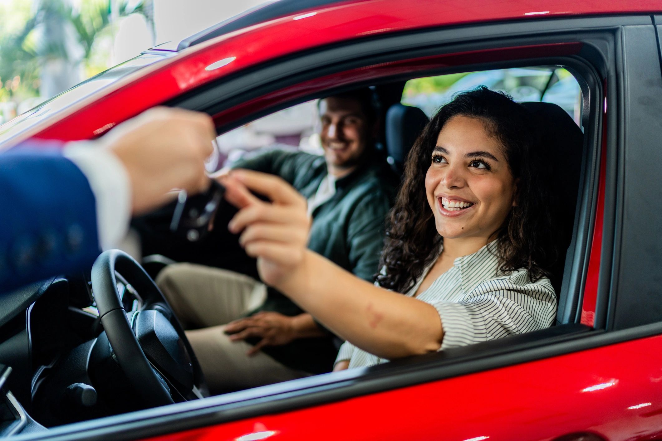 happy car buyer at dealership